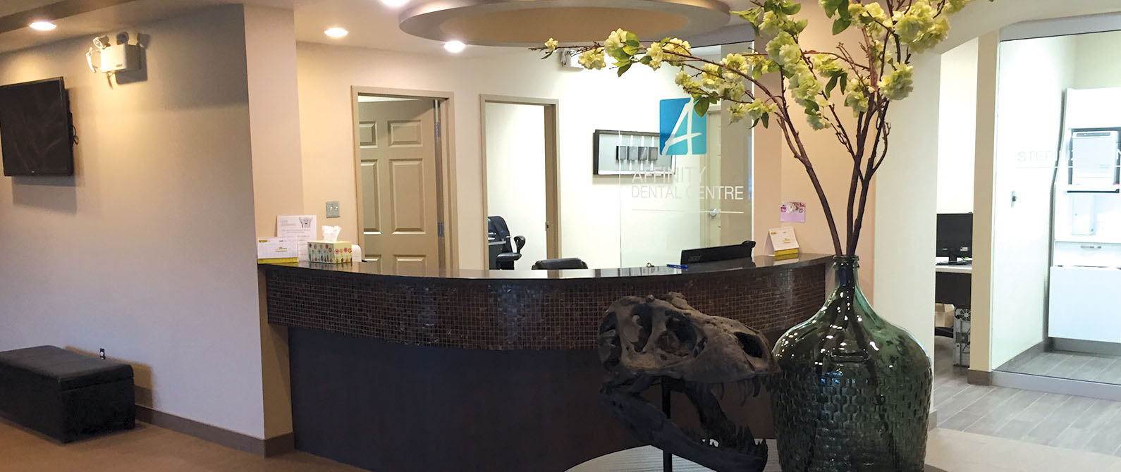 The front desk of a dental office. Learn more about us.